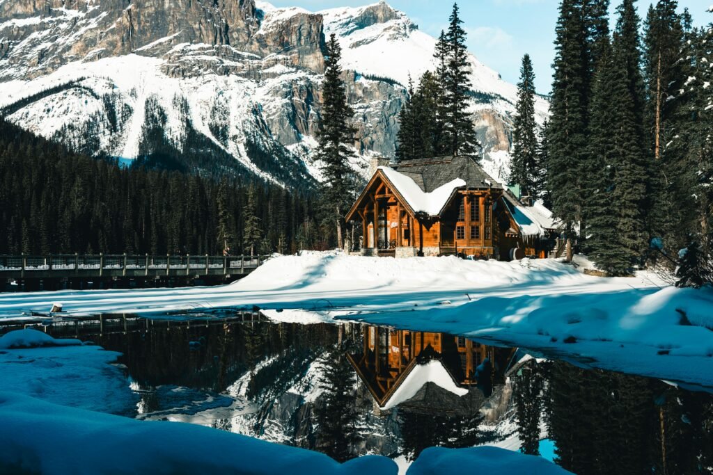 A cozy log cabin surrounded by snowy wilderness in Field, BC, Canada.